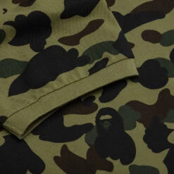 1st Camo One Point Relaxed Fit Polo - Green 11 1st Camo One Point Relaxed Fit Polo - Green -Feature store A Bathing Ape 1St Camo One Point Relaxed Fit Polo Green 001POJ301004M GRN 06 29 23 Feature KN 7