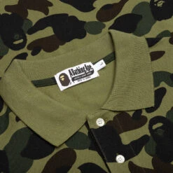 1st Camo One Point Relaxed Fit Polo - Green 9 1st Camo One Point Relaxed Fit Polo - Green -Feature store A Bathing Ape 1St Camo One Point Relaxed Fit Polo Green 001POJ301004M GRN 06 29 23 Feature KN 8