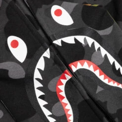 Kids Color Camo Shark Zip Hoodie - Black -Feature store A Bathing Ape Color Kid s Camo Shark Zip Hoodie Black 001ZPJ303007K BLK 04 17 23 Feature KN 7