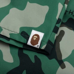 Woodland Camo Beach Shorts - Olive Drab -Feature store A Bathing Ape Woodland Camo Beach Shorts Olive Drab 001SPJ201001M OLD 06 29 23 Feature KN 6